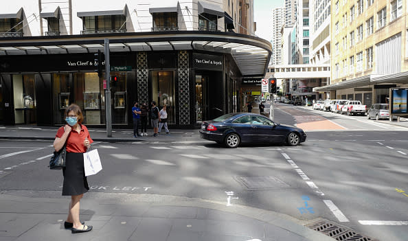 People moving around the Sydney CBD district on a Wednesday morning during the Covid-19 pandemic on in Sydney, Australia. 