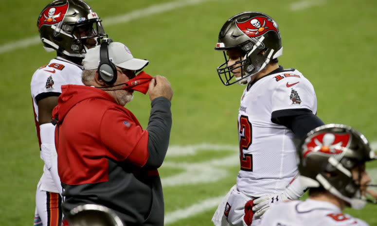 Head coach Bruce Arians of the Tampa Bay Buccaneers meets with Tom Brady #12