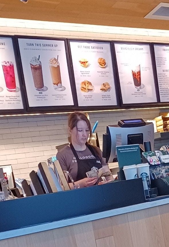 Holly Bogardus works at Starbucks in Rochester during a "sip-in" event Saturday, May 20, 2023.