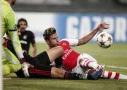 Arsenal's Oliver Grioud (R) fights for the ball with Ramon Motta (C) of Besiktas during the first leg of their Champions League qualifying soccer match at Ataturk Olympic stadium in Istanbul August 19, 2014 REUTERS/Osman Orsal