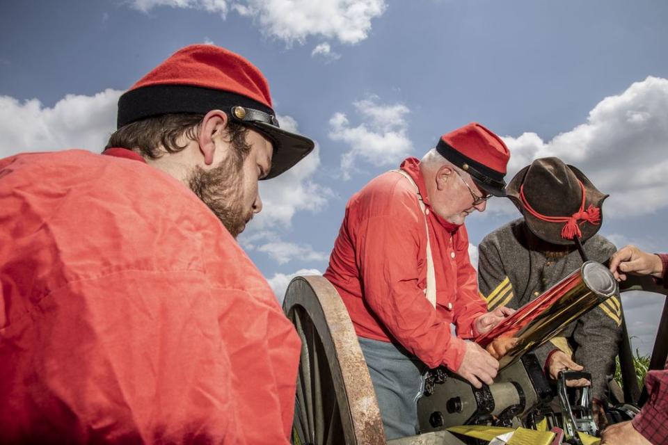 The Knibb’s battery, a reenactment organization from Richmond, Va., prepare a canon for the dedication.