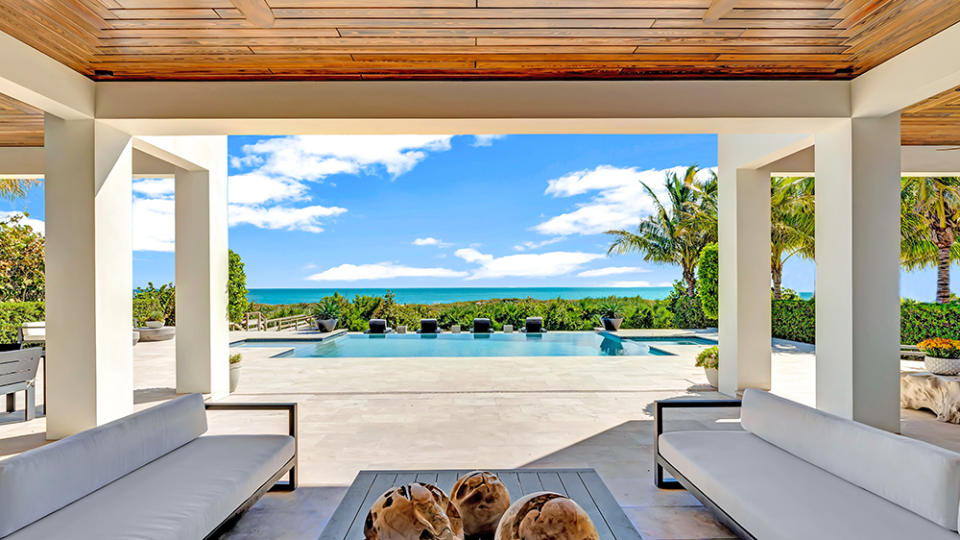 The backyard patio at the Vero Beach estate with views of the zero-edge infinity pool and ocean.