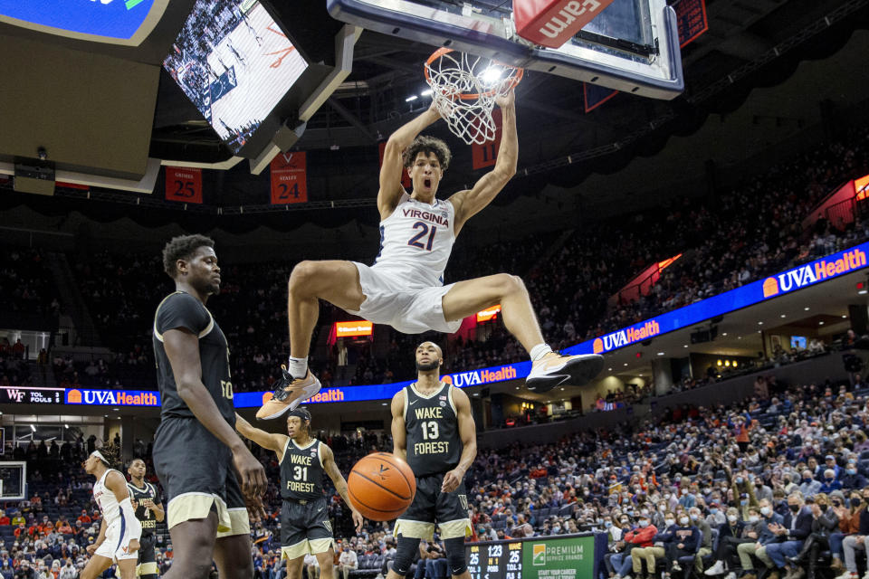 Virginia forward Kadin Shedrick (21) dunks the ball during the first half of an NCAA college basketball game against Wake Forest in Charlottesville, Va., Sat, Jan. 15, 2022. (AP Photo/Erin Edgerton)