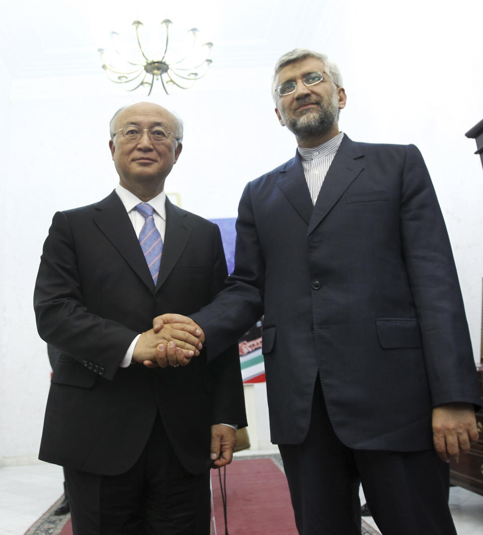 Iran's top nuclear negotiator, Saeed Jalili, right, shakes hands with International Atomic Energy Agency (IAEA) chief Yukiya Amano, at the conclusion of their meeting, in Tehran, Iran, Monday, 21, 2012. The head of the U.N. nuclear agency arrived Monday in Tehran on a key mission that could lead to the resumption of probes by the watchdog on whether Iran has secretly worked on an atomic weapon. It would also strength the Islamic Republic's negotiating hand in crucial nuclear talks with six world powers later this week in Baghdad. (AP Photo/IRNA,Adel Pazzyar)