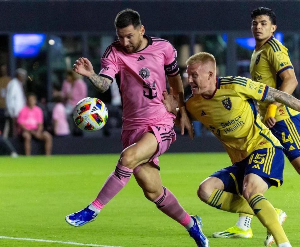 Inter Miami forward Lionel Messi (10) attempts a shot on the goal as Real Salt Lake defender Justen Glad (15) defends in the first half of an MLS match at Chase Stadium on Wednesday, Feb. 21, 2024, in Fort Lauderdale, Fla.