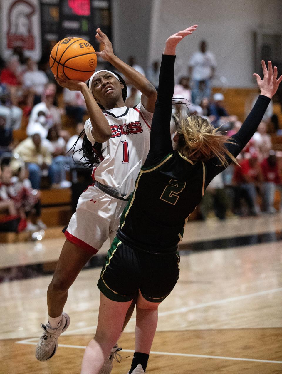 Jadah Toombs of ECS collides with Gracyn Crosby of St. John Neumann as she takes a shot in the Private 8 Girls Basketball Championship game on Friday, Jan. 19, 2024, at Evangelical Christian School in Fort Myers.