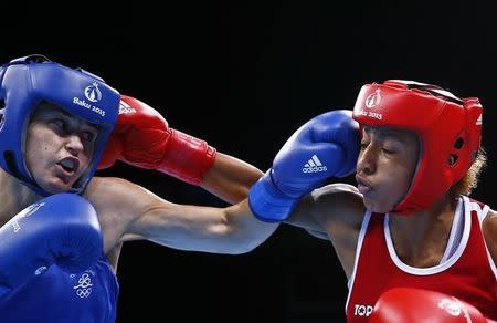 Eselle Mossely of France (R) and Katie Taylor of Ireland fight during their women's 60kg Light weight boxing gold medal fight at the 1st European Games in Baku, Azerbaijan, June 27 , 2015. REUTERS/Kai Pfaffenbach