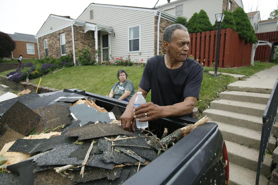 Residents Jenny Alcala, left, and Norman Roland with a truck load of debris from the Salem Bend Condominiums in Trotwood where a tornado struck on Memorial Day. (WHIO File)