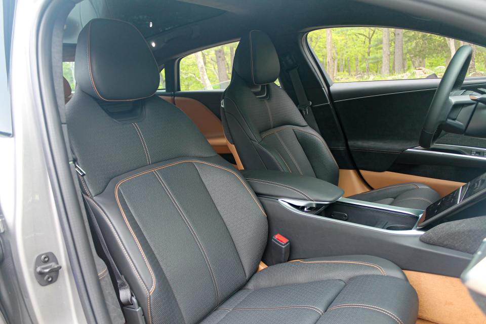 A photo of the front seats of the Lucid Air electric car, as seen from the open passenger side door.