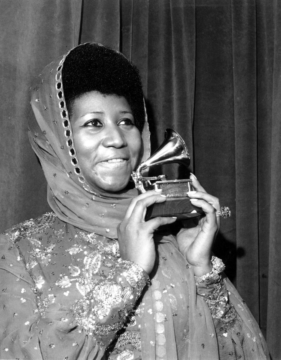 FILE - In this March 3, 1975 file photo, singer Aretha Franklin poses with her Grammy Award for for best female R&B vocal performance for "Ain't Nothing Like the Real Thing" at the 17th Annual Grammy Award presentation in New York. Franklin died Thursday, Aug. 16, 2018 at her home in Detroit. She was 76. (AP Photo, File)