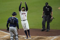 Tampa Bay Rays catcher Mike Zunino watches as Houston Astros George Springer celebrates his two run home run against the Tampa Bay Rays during the fifth inning in Game 4 of a baseball American League Championship Series, Wednesday, Oct. 14, 2020, in San Diego. (AP Photo/Ashley Landis)