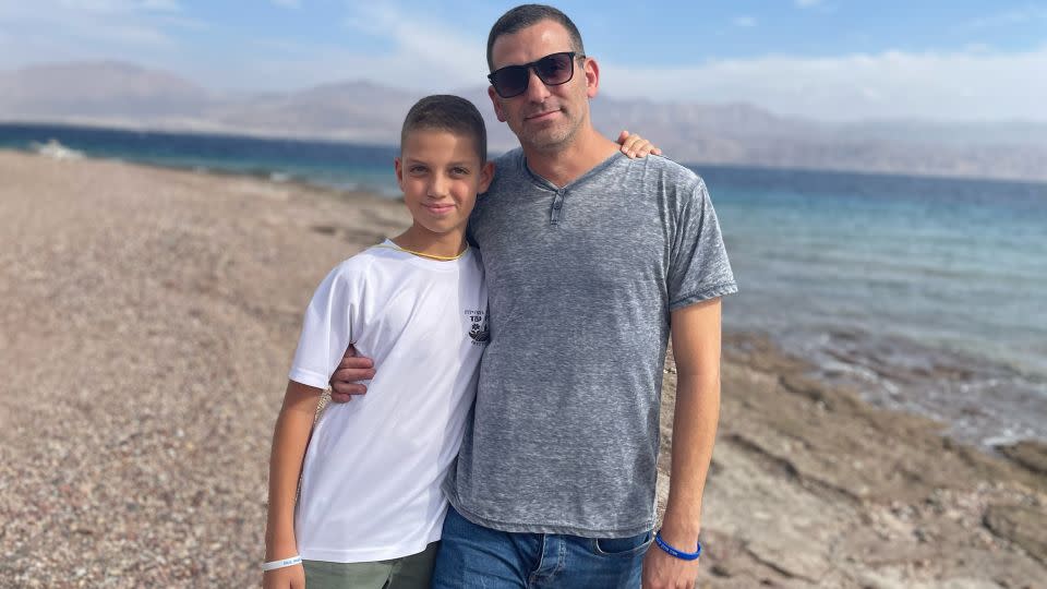 Yonathan Barr and his 12-year-old son, Uri, on the beach in Eilat. - Rebecca Wright/CNN