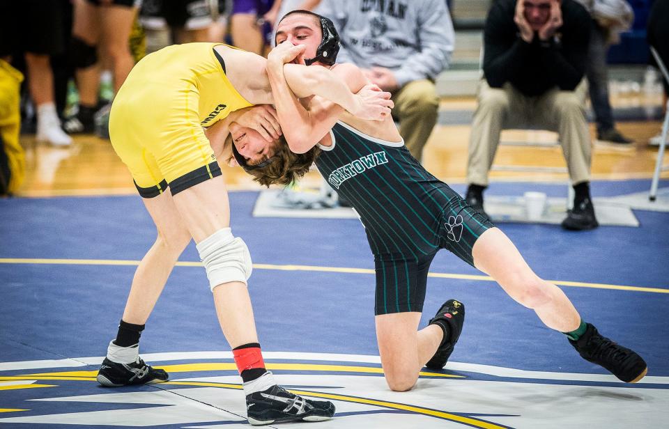 Yorktown's Cole Stuffel faces off against Cowan's Keith Bowen in the 113 pound weight class at Delta High School Saturday, Jan. 29, 2022. 
