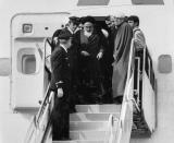 FILE - In this Feb. 1, 1979 file photo, Ayatollah Ruhollah Khomeini, Iran's exiled religious leader, emerges from a plane after his arrival at Mehrabad airport in Tehran, Iran. Friday, Feb. 1, 2019, marks the 40th anniversary of Khomeini's descent from the chartered Air France Boeing 747, a moment that changed the country’s history for decades to come. (AP Photo/FY, File)