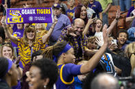 LSU fans celebrate as players leave the court after defeating Utah in a Sweet 16 college basketball game in the women's NCAA Tournament in Greenville, S.C., Friday, March 24, 2023. (AP Photo/Mic Smith)