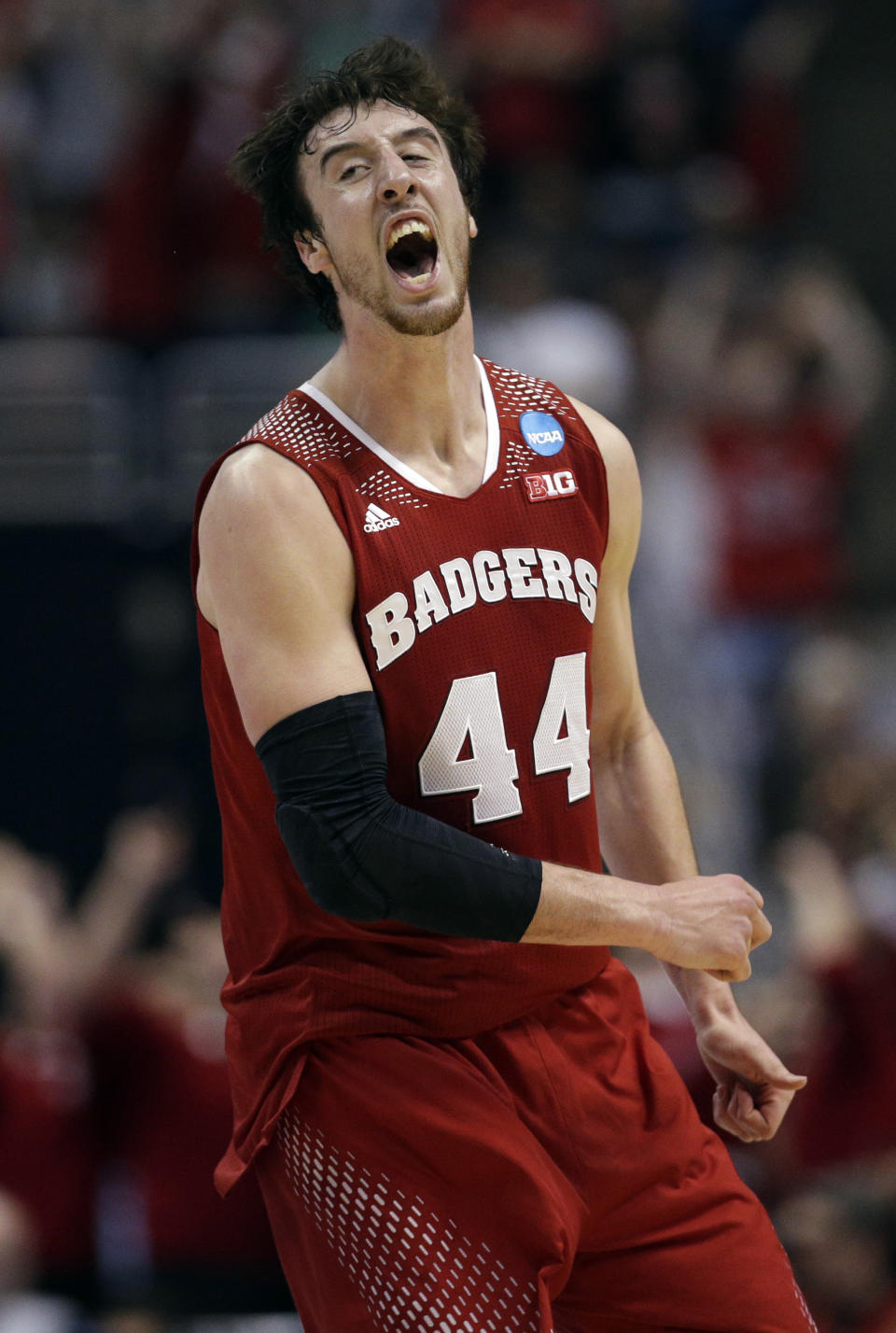 Wisconsin 's Frank Kaminsky reacts after making a three-point basket during the second half in a regional final NCAA college basketball tournament game against Arizona, Saturday, March 29, 2014, in Anaheim, Calif. (AP Photo/Jae C. Hong)