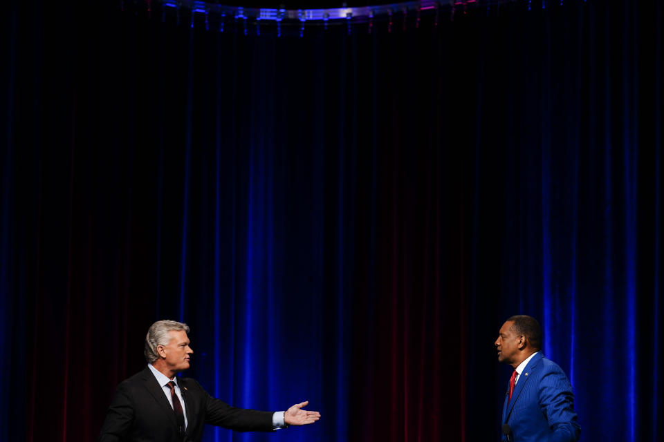 Mike Collins, left, and Vernon Jones participate in Georgia's 10th Congressional District republican primary election runoff debates on Monday, June 6, 2022, in Atlanta. (AP Photo/Brynn Anderson)