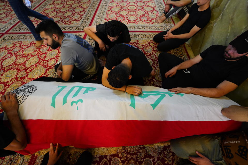 People attend a funeral ceremony for people killed after Iraqi Shiite cleric Muqtada al-Sadr loyalists stormed the Republican Palace in Baghdad, in Najaf, Iraq, August 30, 2022. / Credit: Karar Essa/Anadolu Agency/Getty