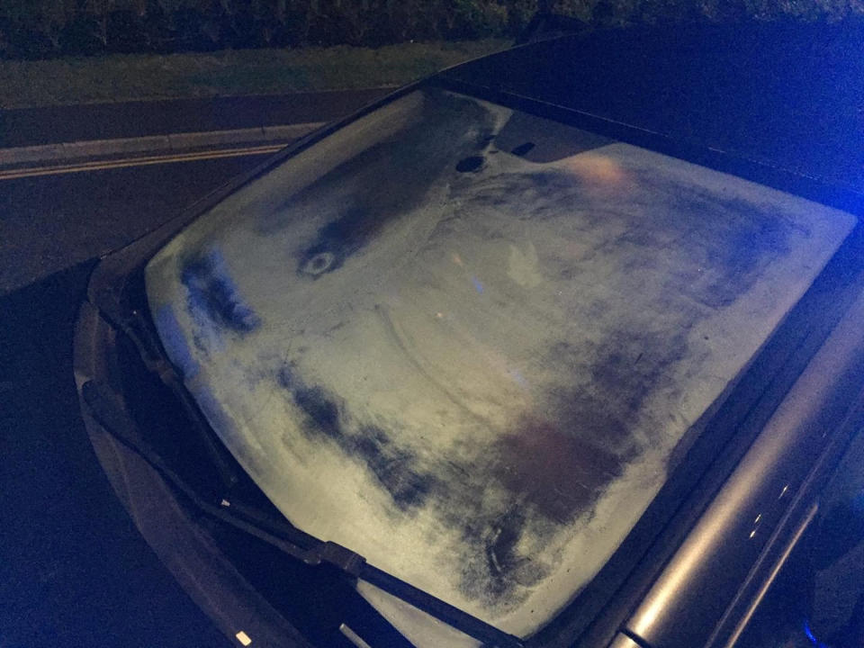 The almost entirely iced up windscreen of a driver pulled over by police iin Rugby, Warks., on Thursday (20/2). See SWNS story SWMDwindow. Cops pulled over a "blindfolded" motorist who drove with frost almost entirely covering their windscreen. The reckless driver was pulled over in Rugby, Warks., on Thursday (20/2) night after traffic cops became concerned about his visibility. Officers from Warwickshire Police posted pictures of the car on Facebook, saying the motorist was effectively driving blindfolded. Writing on the OPU Warwickshire page, they wrote: So... quite what the driver could see through their windscreen I'd suggest is slightly limited! 