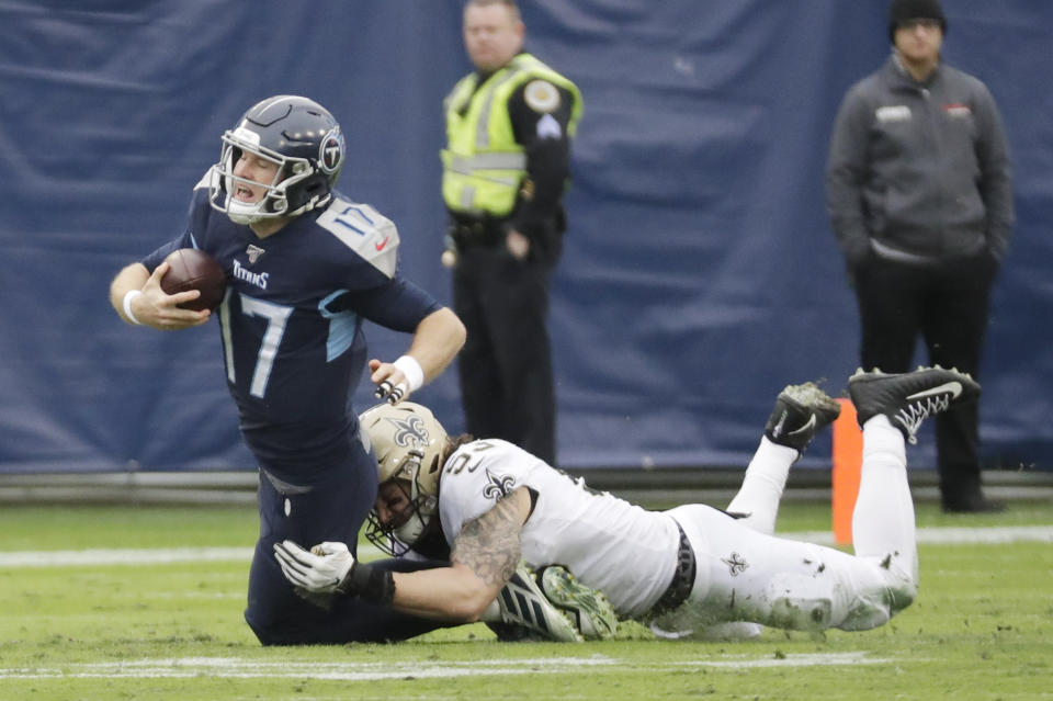 Tennessee Titans quarterback Ryan Tannehill (17) is sacked by New Orleans Saints outside linebacker A.J. Klein (53) in the first half of an NFL football game Sunday, Dec. 22, 2019, in Nashville, Tenn. (AP Photo/James Kenney)