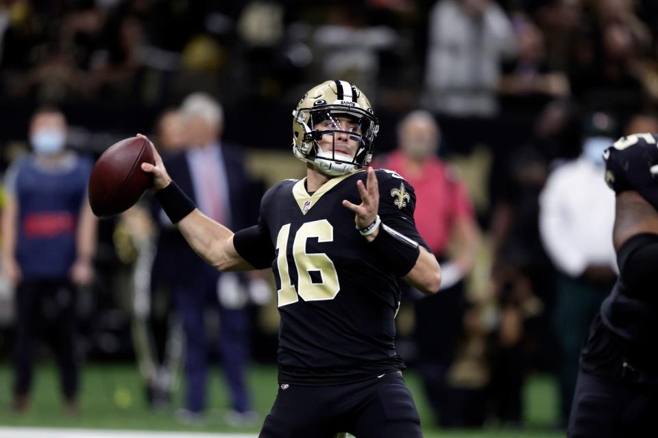 New Orleans Saints quarterback Ian Book (16) throws a pass against the Miami Dolphins during the first half of an NFL football game Monday, Dec. 27, 2021, in New Orleans. (AP Photo/Butch Dill)