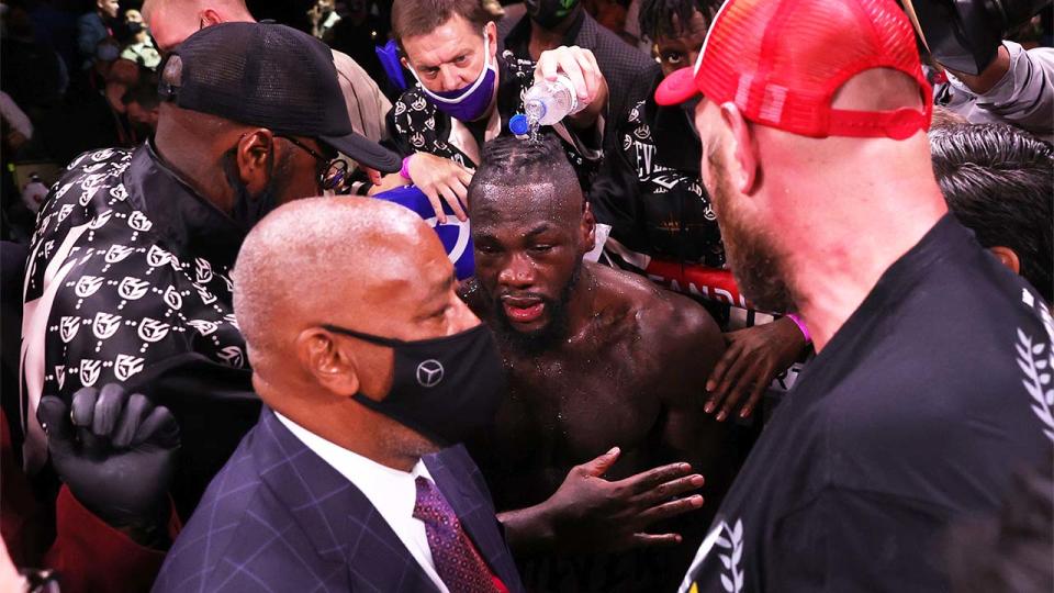 Deontay Wilder (pictured middle) refusing to talk to Tyson Fury (pictured right) after their fight.