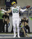 Green Bay Packers tight end Robert Tonyan (85) reacts after catching a pass for a touchdown against the Seattle Seahawks during the first half of an NFL football game, Thursday, Nov. 15, 2018, in Seattle. (AP Photo/Stephen Brashear)