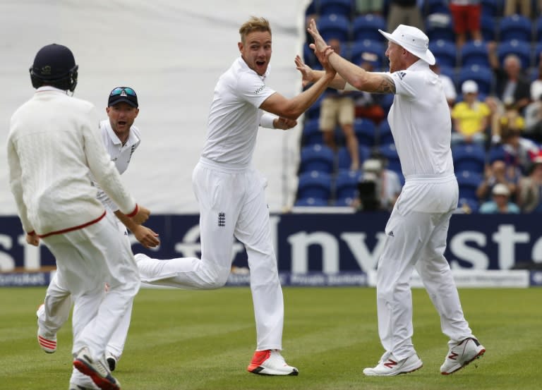 England's Stuart Broad (2nd R) celebrates after taking the wicket of Australia's Steve Smith on the fourth day of the opening Ashes Test in Cardiff, south Wales, on July 11, 2015