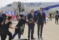 U.S. Presidential Adviser Jared Kushner, right, receives a microphone as he stands next to U.S. National Security Adviser Robert O'Brien ahead of boarding the El Al's flight, which will carry an Israeli-American delegation from Tel Aviv to Abu Dhabi, at the Ben-Gurion Airport near Tel Aviv, Israel Monday, Aug. 31, 2020. (Menahem Kahana/Pool Photo via AP)