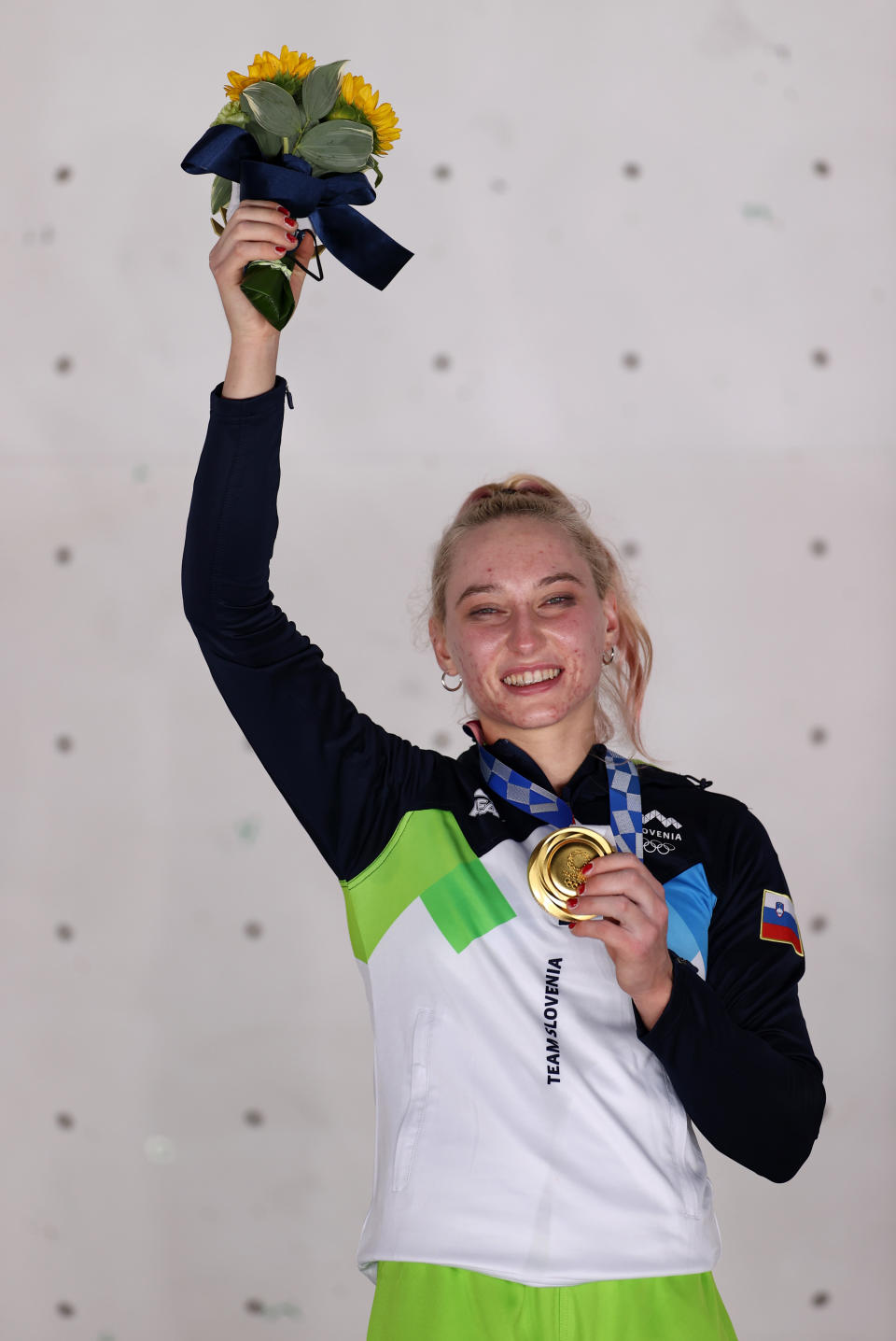 Janja Garnbret of Team Slovenia poses with the gold medal for Sport Climbing