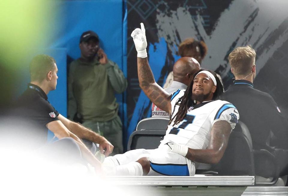 Carolina Panthers linebacker Shaq Thompson acknowledges the cheers of the fans as he is driven off the field after being injured during first-quarter action against the New Orleans Saints at Bank of America Stadium on Monday, September 18, 2023.