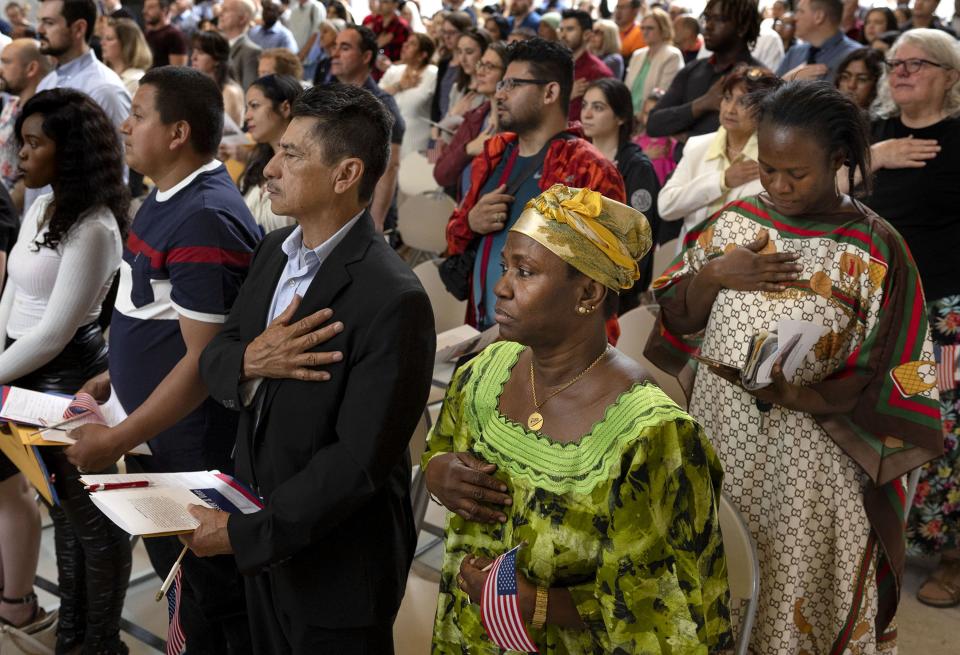 Applicants recite the Pledge of Allegiance during a naturalization ceremony to become citizens of the United States at the Capitol in Salt Lake City on Wednesday, June 14, 2023. | Laura Seitz, Deseret News