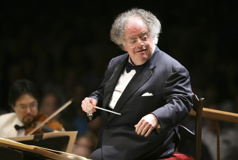 FILE - Boston Symphony Orchestra music director James Levine conducts the symphony on its opening night performance at Tanglewood in Lenox, Mass. on July 7, 2006. Levine, who ruled over the Metropolitan Opera for 4 1/2 decades before being eased out when his health declined and then fired for sexual improprieties, died March 9, 2021 in Palm Springs, Calif., of natural causes, his physician of 17 years, Dr. Len Horovitz, said Wednesday, March 17. He was 77. (AP Photo/Michael Dwyer, File)