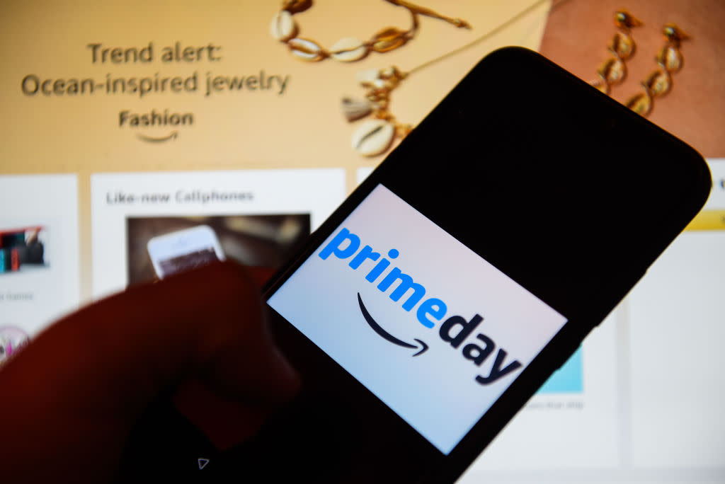 Picture of someone holding a phone with Amazon Prime logo