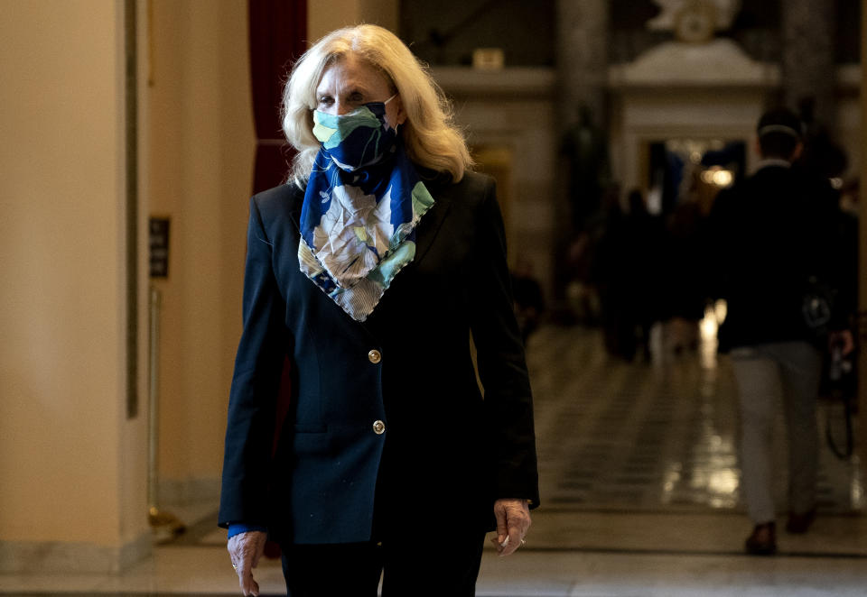 WASHINGTON, DC - JANUARY 13: Rep. Carolyn Maloney (D-NY) wears a protective mask while walking to the House Floor at the U.S. Capitol on January 13, 2021 in Washington, DC. The House of Representatives moved forward with impeachment following Vice President Mike Pences refusal to use the 25th amendment to remove Trump from office after protestors breached the U.S. Capitol last week. (Photo by Stefani Reynolds/Getty Images)