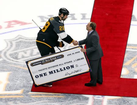 Jan 31, 2016; Nashville, TN, USA; Pacific Division forward John Scott (28) of the Montreal Canadiens shakes hands with NHL Commissioner Gary Bettman after the 2016 NHL All Star Game at Bridgestone Arena. Mandatory Credit: Aaron Doster-USA TODAY Sports