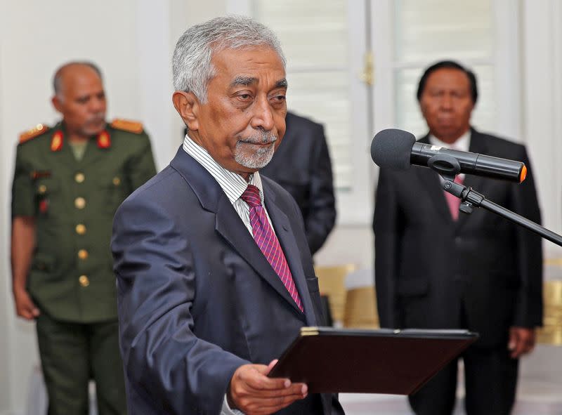 FILE PHOTO: East Timor Prime Minister Mari Alkatiri stands during his swearing-in ceremony in Dili