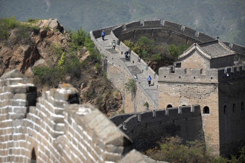 Visitors walk along the Jinshanling section of the Great Wall of China in northern China's Hebei Province, Wednesday, July 5, 2023. (AP Photo/Mark Schiefelbein)