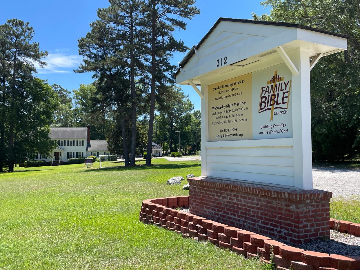 Family Bible Church's two-story building sits in the background as the church's sign greets motorists from McCormick Road in Martinez.