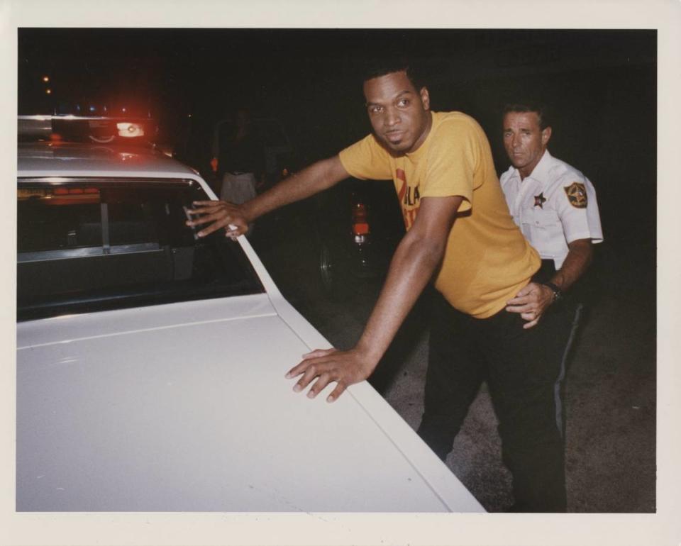 Leader of the Band: 2 Live Crew’s Luther Campbell is frisked by a Broward sheriff’s policeman early Sunday before he was charged with violating obscenity laws during a performance at a club in Hollywood Mike Stocker/The Miami Herald