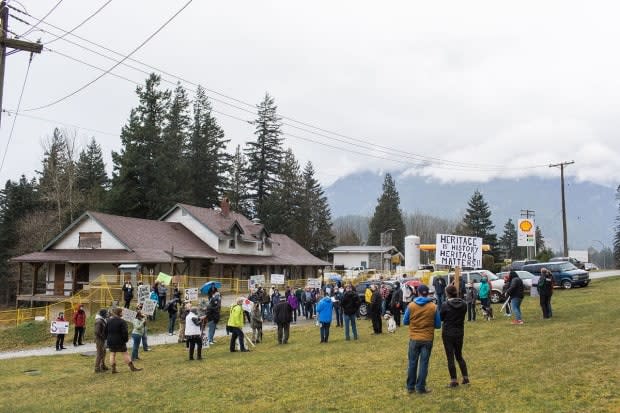 Concerned residents rally around the 1916 Hope Station House in Hope, B.C., in March.