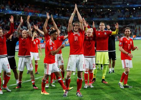 Football Soccer - Wales v Belgium - EURO 2016 - Quarter Final - Stade Pierre-Mauroy, Lille, France - 1/7/16 Wales' Gareth Bale, Neil Taylor and Joe Allen celebrate at full time REUTERS/Carl Recine Livepic