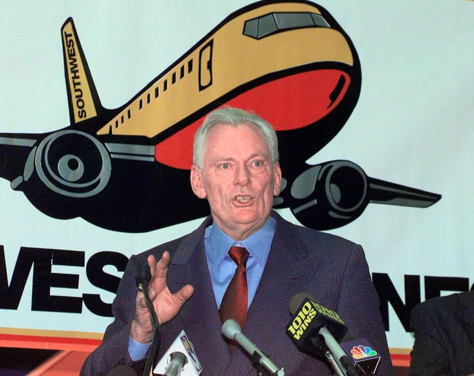 FILE - In this Dec. 9, 1998, file photo, Southwest Airlines President and CEO Herb Kelleher speaks at a news conference at MacArthur Airport in Islip, N.Y. Not many CEOs dress up as Elvis Presley, settle a business dispute with an arm-wrestling contest, or go on TV wearing a paper bag over their head. Southwest confirmed Kelleher died on Thursday, Jan. 3, 2019. He was 87. (AP Photo/Ed Betz, File) ORG XMIT: NYHK402