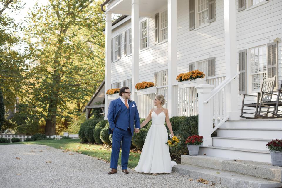 This photo shows Shelley Kapitulik-Jaye and her husband, Stephen Jaye, on Oct. 20, 2021, in Norwalk, Conn.. The two wed on a Wednesday, tapping into a trend of couples choosing weekdays for their weddings, either by choice or necessity. (Mindy Briar Photography via AP)