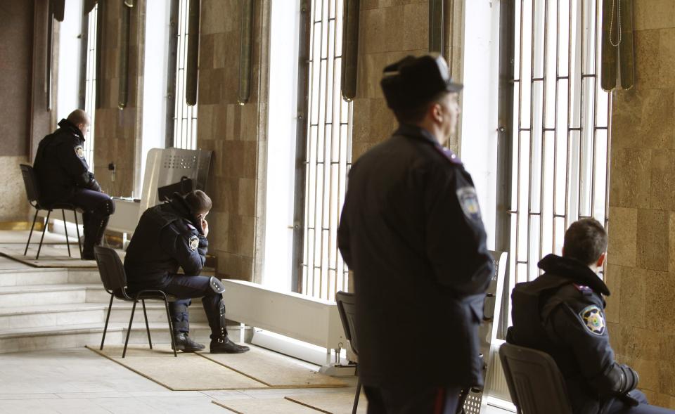 Ukrainian policemen guard in a building of the regional administration in the eastern city of Donetsk