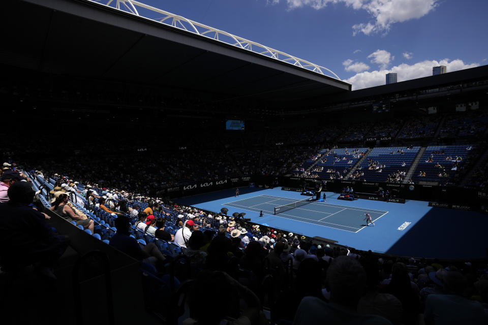 FILE - Donna Vekic, right, of Croatia plays a backhand return to Aryna Sabalenka of Belarus on Rod Laver Arena during their quarterfinal match at the Australian Open tennis championship in Melbourne, Australia, Wednesday, Jan. 25, 2023. The 2024 Australian Open, the year's first Grand Slam tennis tournament, begins at Melbourne Park on Sunday morning (Saturday night ET). That's a day earlier than usual, creating a 15-day event for the first time.(AP Photo/Aaron Favila, File)