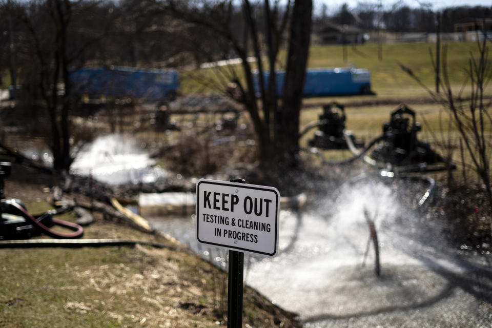 FILE - Cleanup of a creek is underway in the aftermath of a train derailment in East Palestine, Ohio, Wednesday, March 8, 2023. Norfolk Southern alone will be responsible for paying for the cleanup after last year's fiery train derailment in eastern Ohio, a federal judge ruled, Wednesday, March 6, 2024. (AP Photo/Matt Rourke, File)