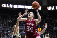 FILE - Indiana forward Mackenzie Holmes (54) shoots against Purdue in the first half of an NCAA college basketball game in West Lafayette, Ind., Sunday, Feb. 5, 2023. Holmes was honored as an All-American by The Associated Press on Wednesday, March 15, 2023. (AP Photo/Michael Conroy, File)