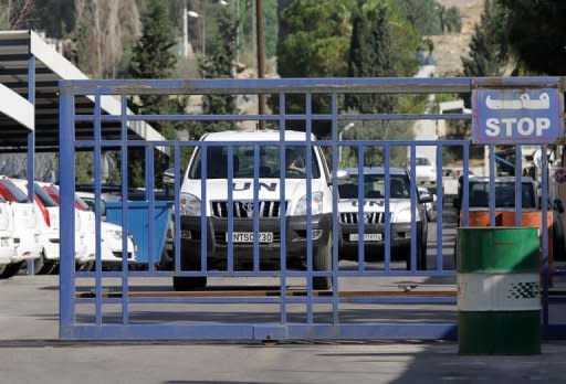 A United Nations monitors convoy leaves the UN headquarters in Damascus