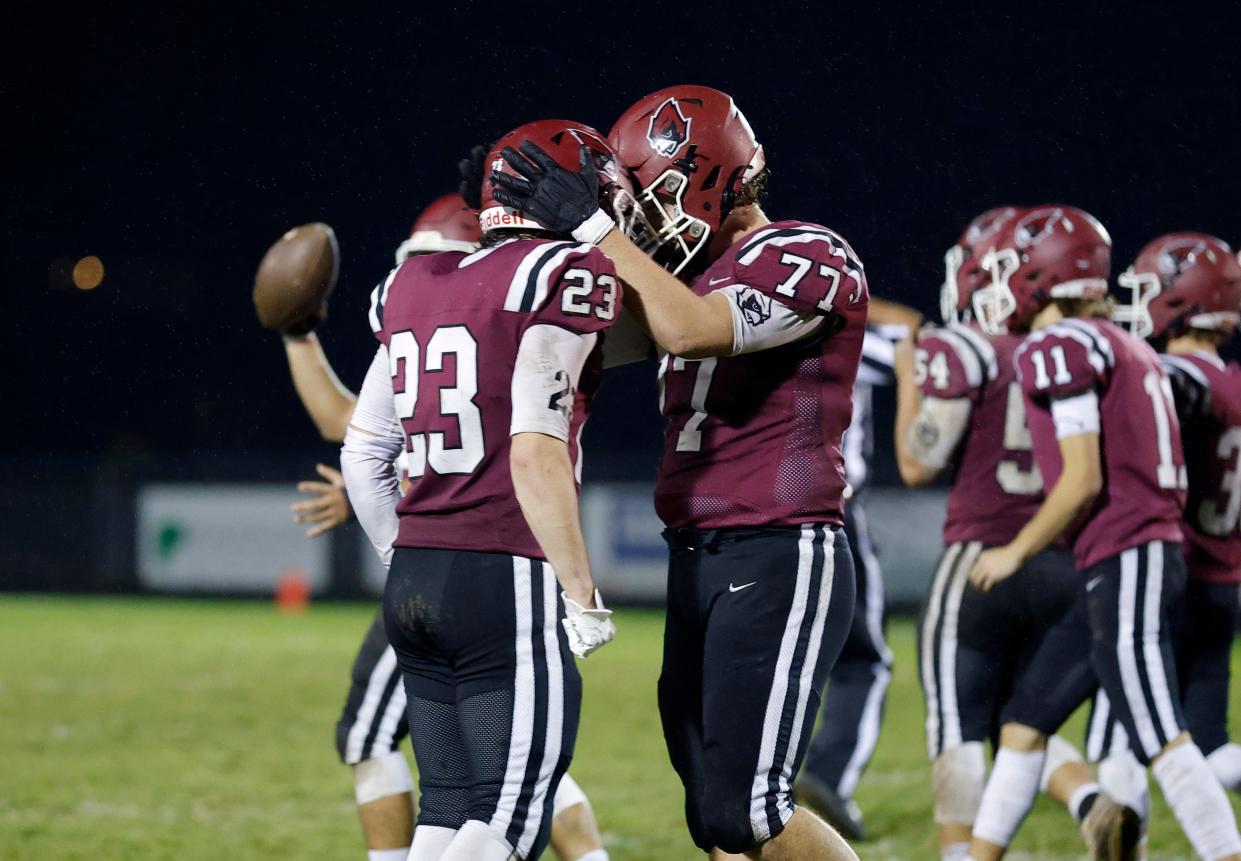 Portland's Christopher Battley, left, and Danton Marowelli (77) celebrate after defeating Sexton, Friday, Oct. 27, 2023, at Portland High School.